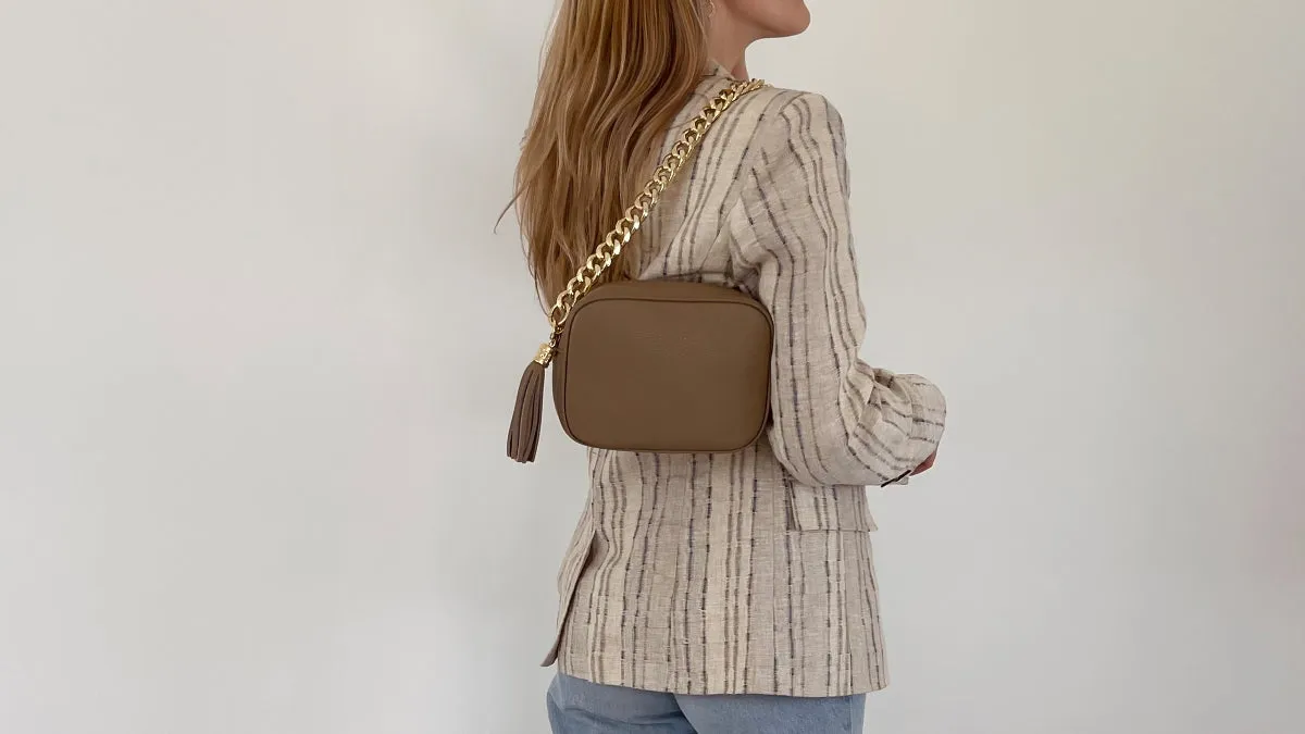 The Tassel Latte Leather Crossbody Bag With Gold Chain Strap